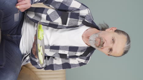 Vertical-video-of-Dieting-old-man-makes-a-choice.